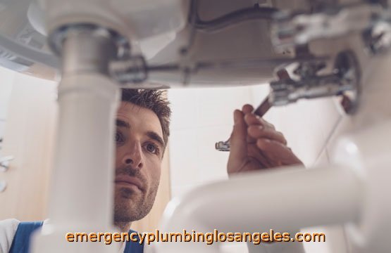 Plumber fixing sink at home Los Angeles